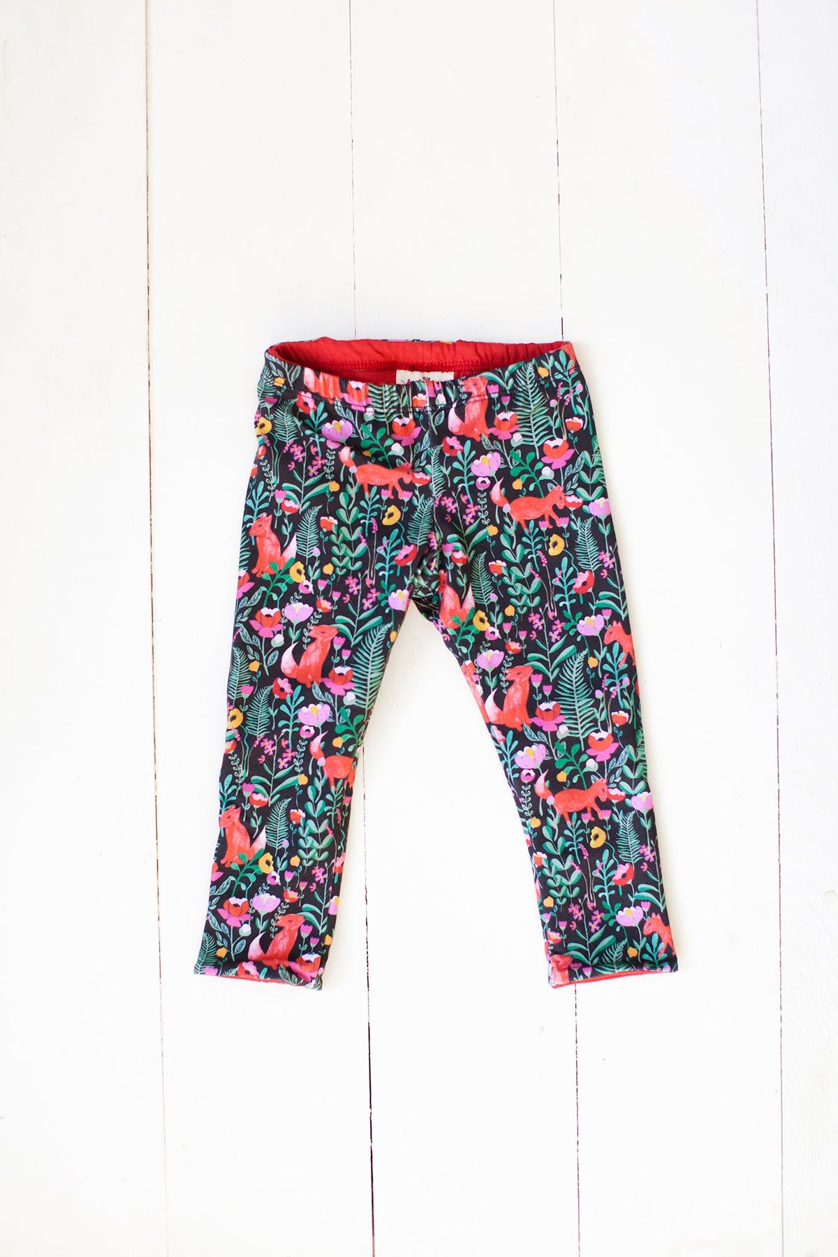Reversible leggings in fox floral/spicy red
